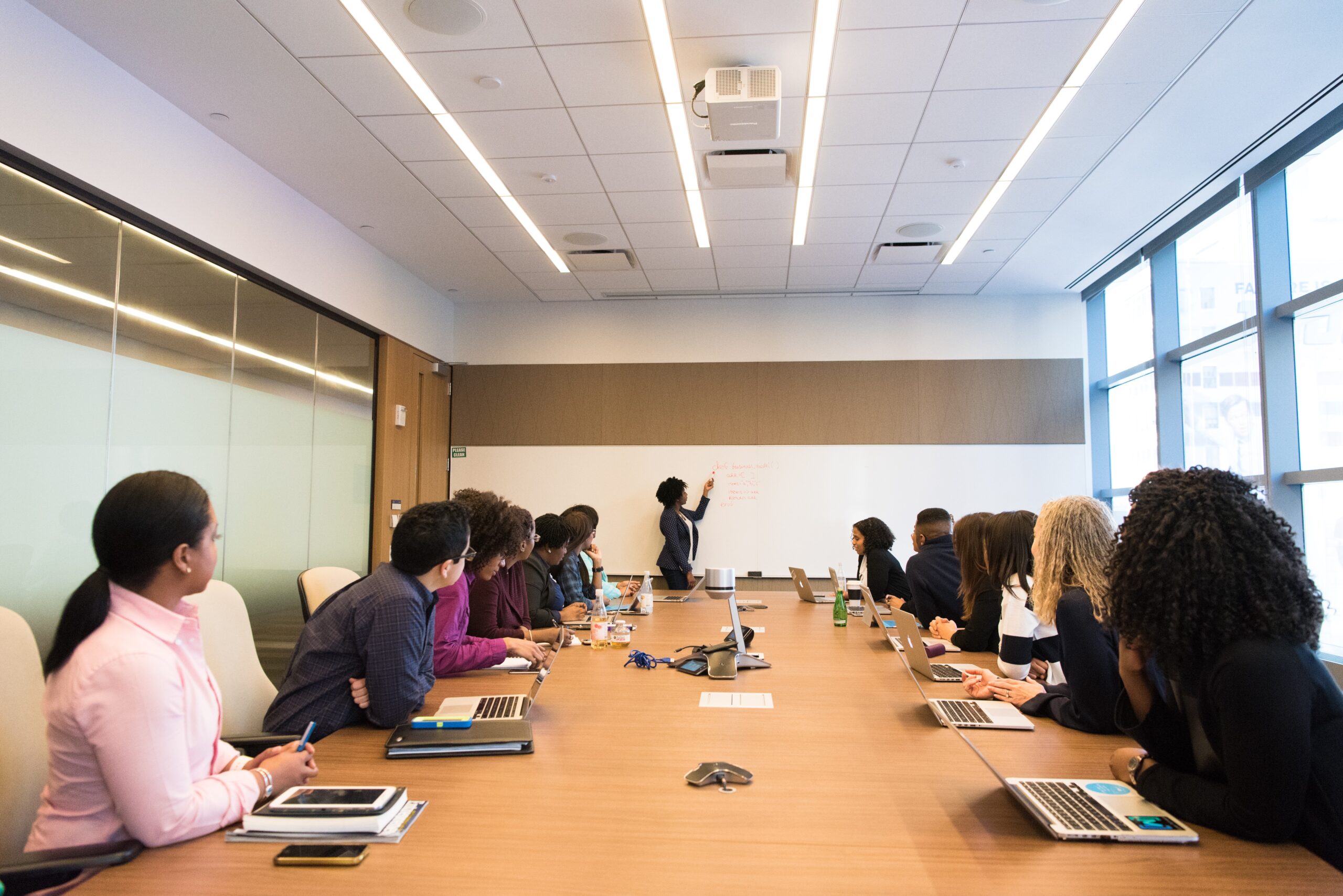 Several people in a meeting around a table